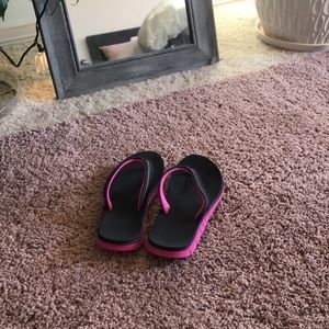 Kids pink and black flip flops. Durable!